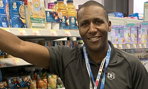 Member posing in the store