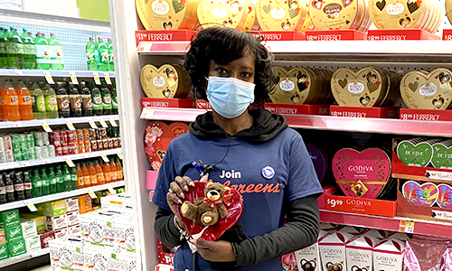 Member holding valentine's day merchandise 