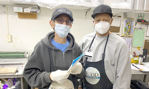 two members standing side by side