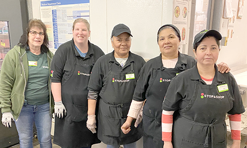 five members lined up for a group picture