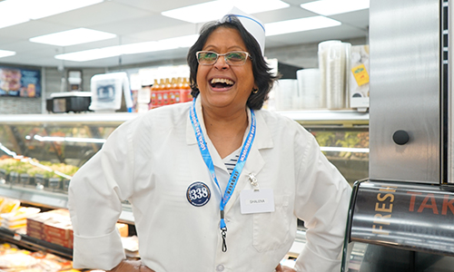 Member Smiling at a Deli Counter